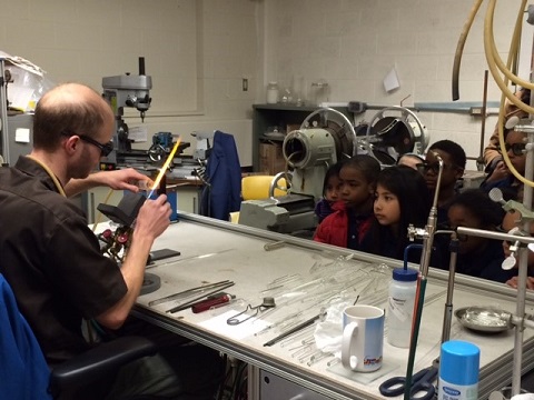 second grade students in glassblowing facility