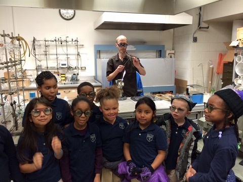 second grade students in glassblowing facility