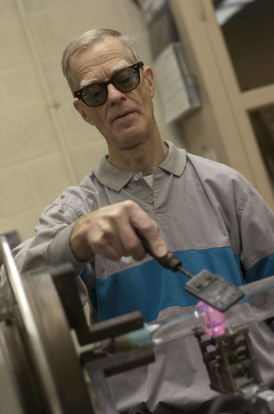 Peter Hatch glassblowing at the lathe